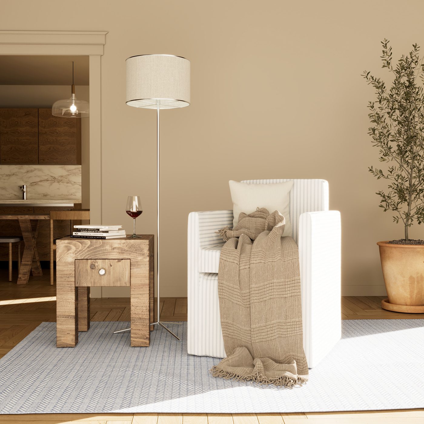 Living-room corner with a linen armchair and olive tree
